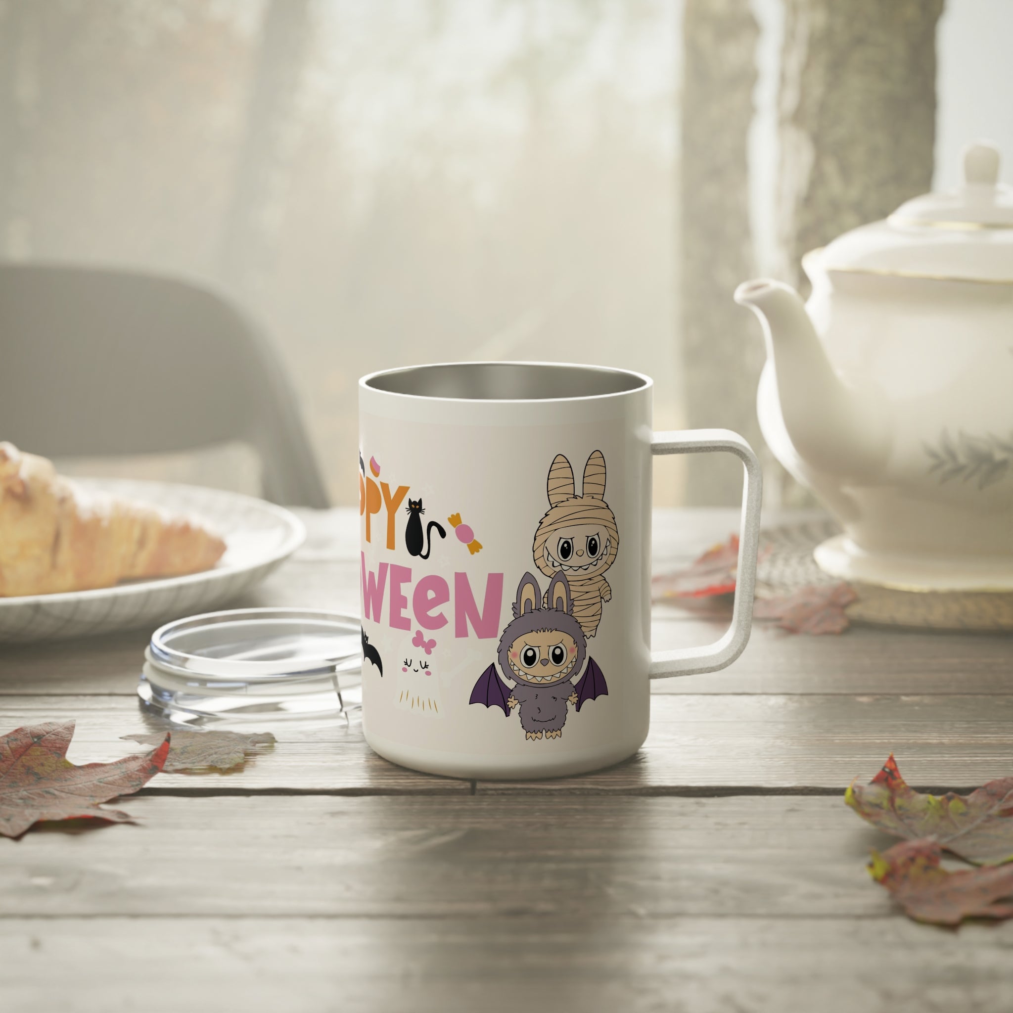 Happy Halloween coffee mug on cozy breakfast table, showing Labubu characters in costumes with autumn leaves around.